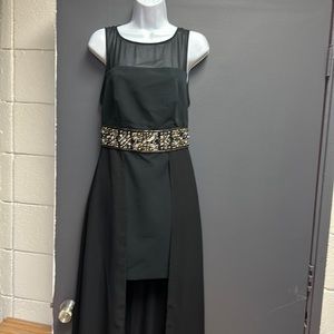 Bebe dress short in the front and long shear long n the back. Rhinestones